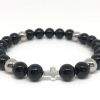 Bracelet élastique perles en verre noir, acier inoxydable et croix en argent massif