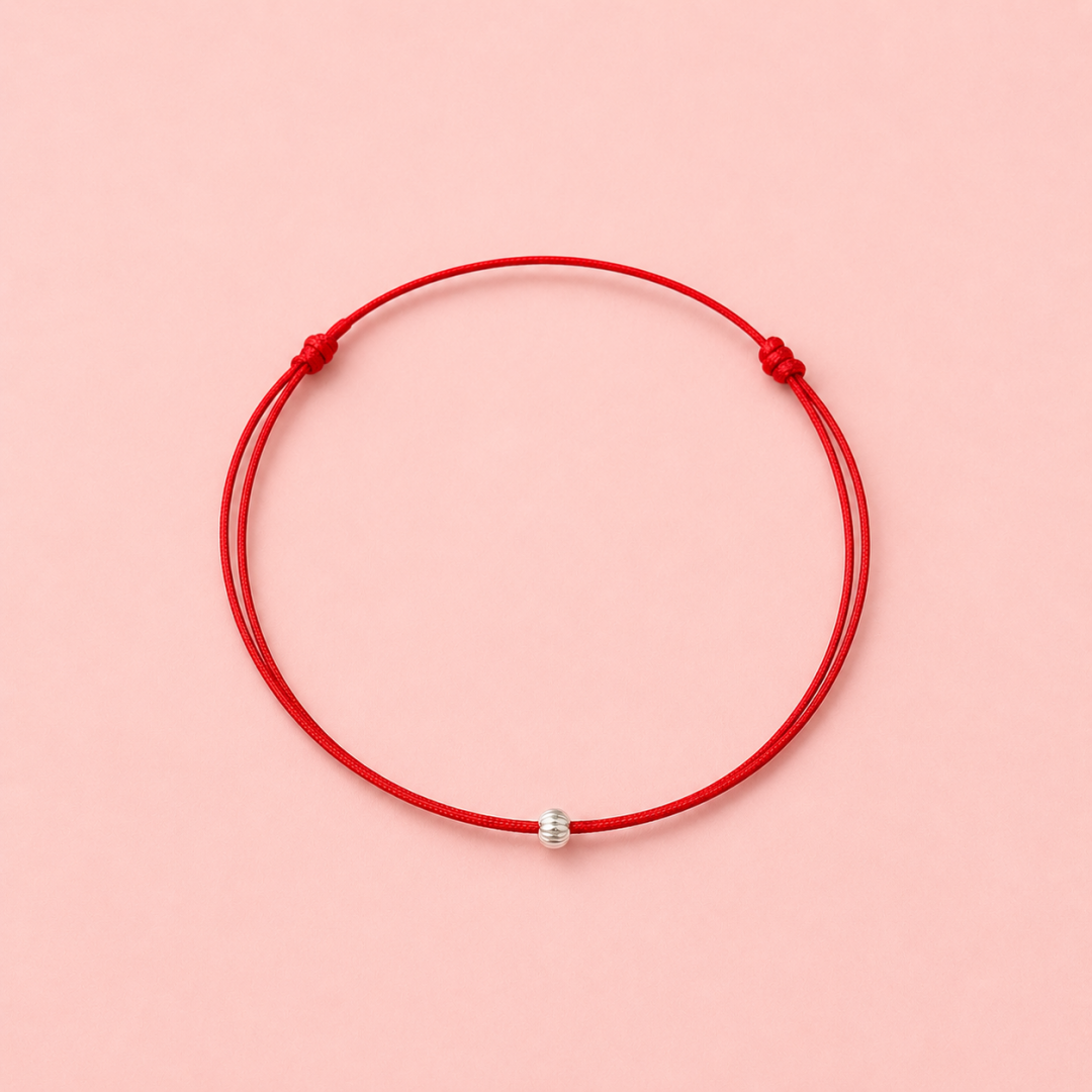 Bracelet cordon ajustable, perle striée en argent massif